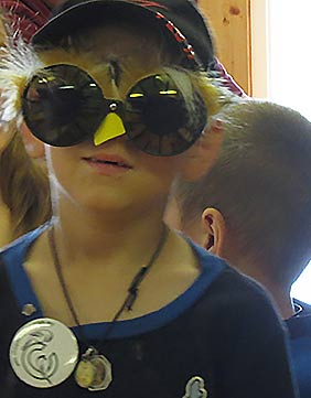 Young person wearing bird glasses